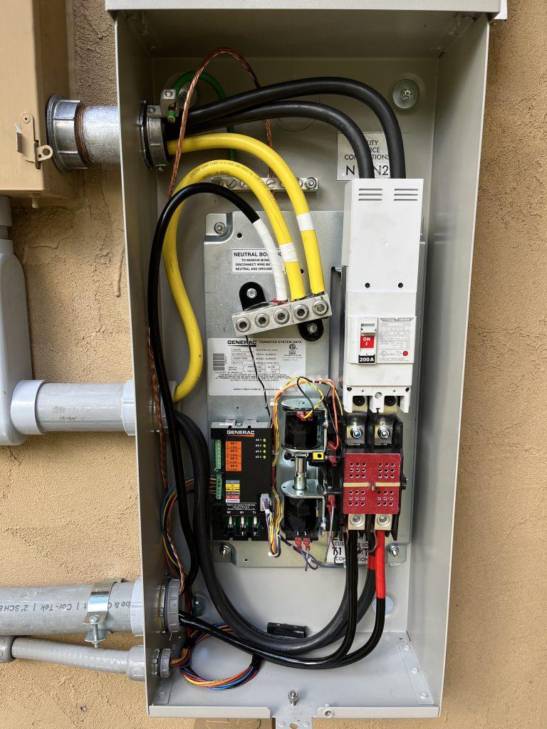 gray automatic transfer switch cover off and wires inside
